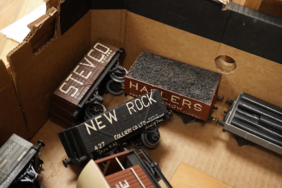 Eleven 0 gauge railway wooden freight wagons, wooden bodies and most possibly kit built using Bonds etc. parts, including a Leeds bogie mineral wagon, together with two kit or scratchbuilt wooden London Underground stati